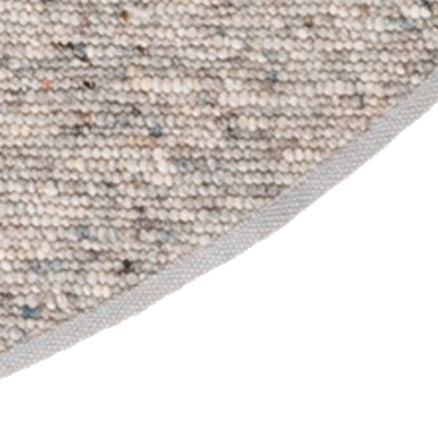 Afwerkingsbies rond wollen vloerkleed Nanda