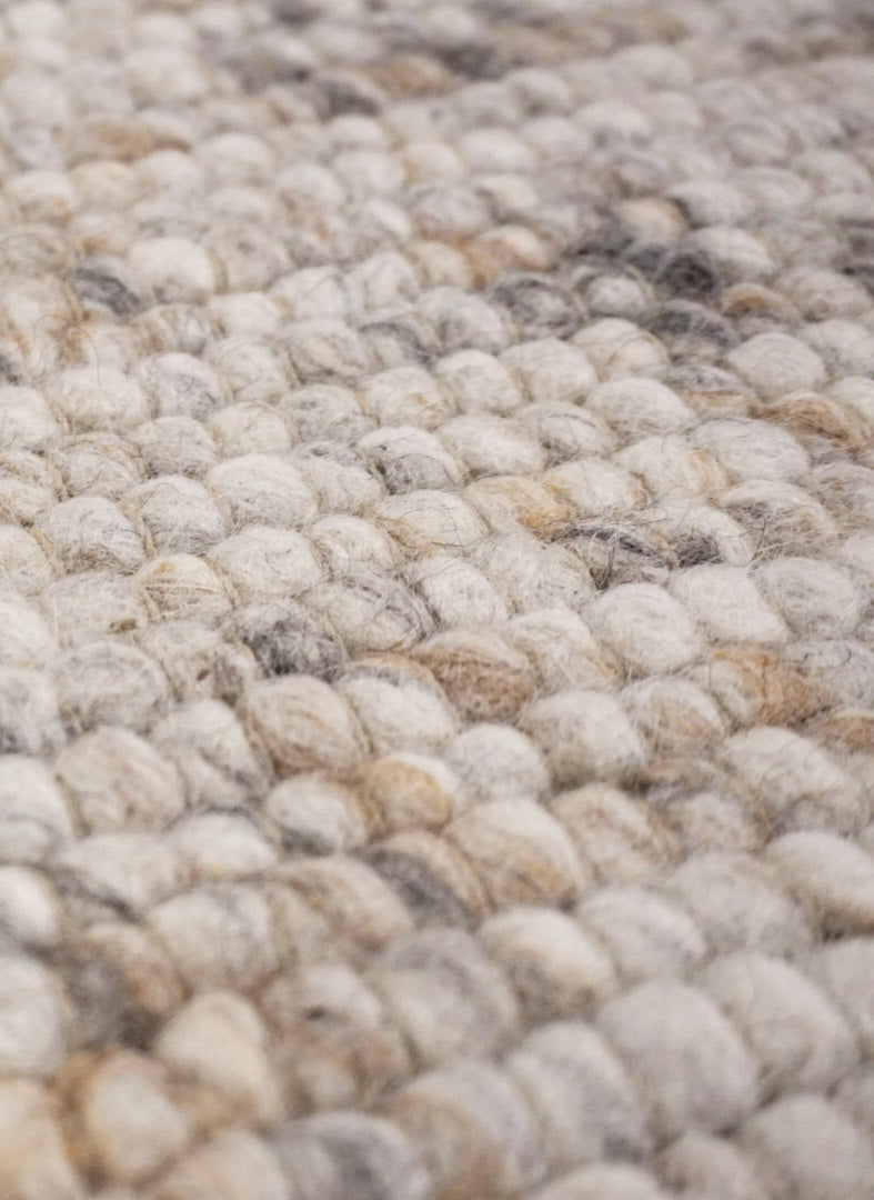 Rond handgeweven wollen vloerkleed Ankie Beige close-up