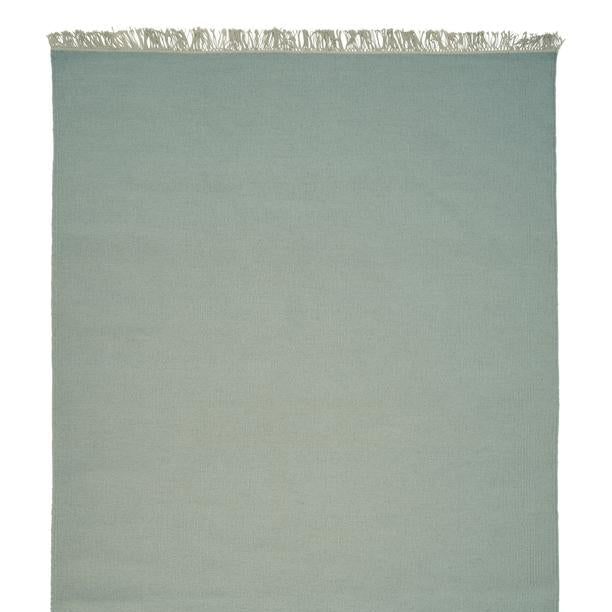 Wollen vloerkleed hip met flosjes Robijn Sky