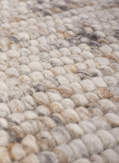 Rond handgeweven wollen vloerkleed Ankie Beige close-up