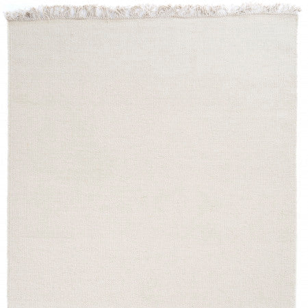 Wollen vloerkleed hip met flosjes Robijn White